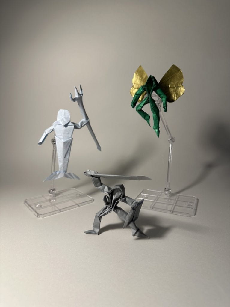 An origami mermaid, warrior, and fairy, designed by Ronik Bhaskar.