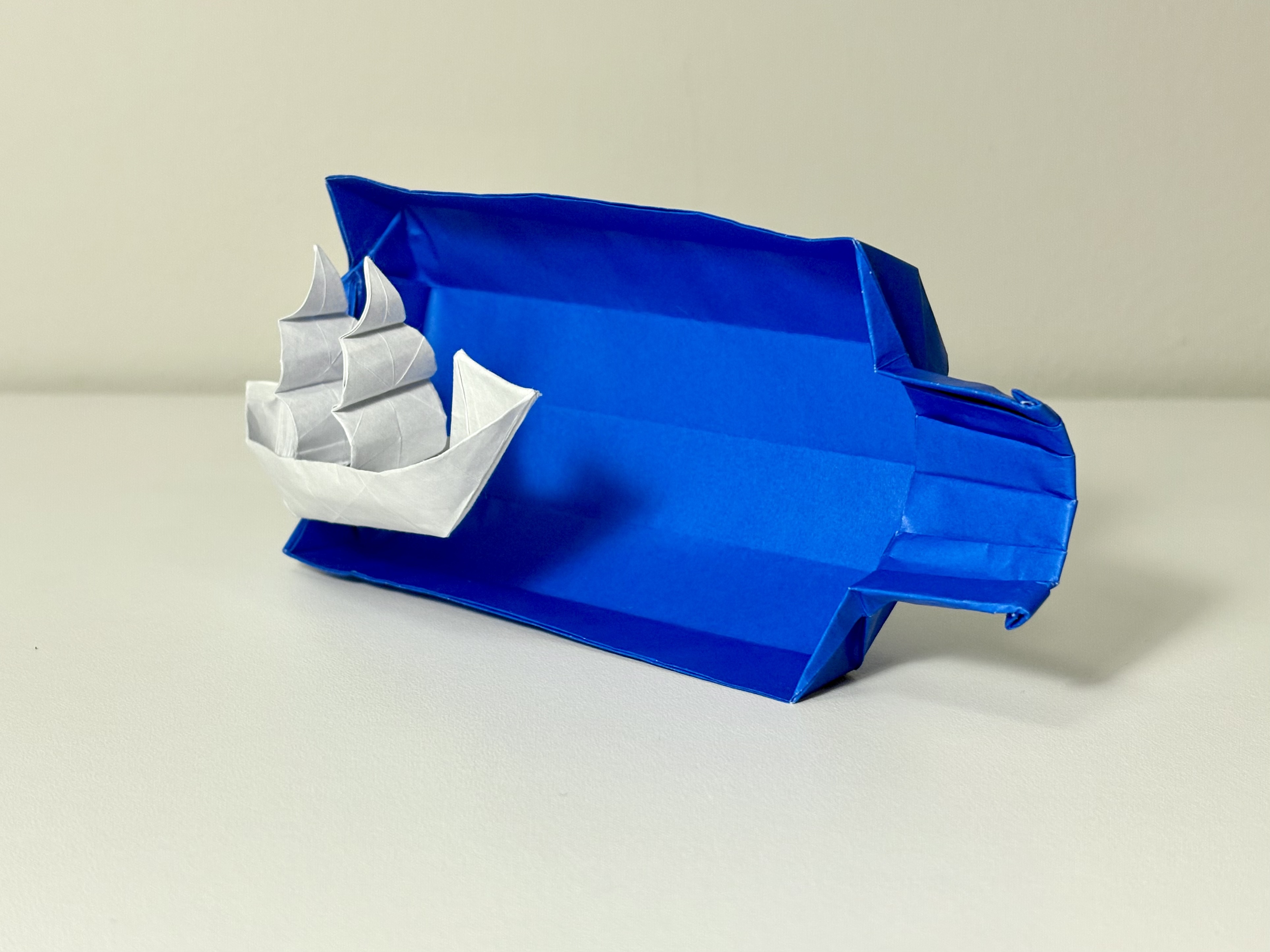 Origami ship in a bottle.