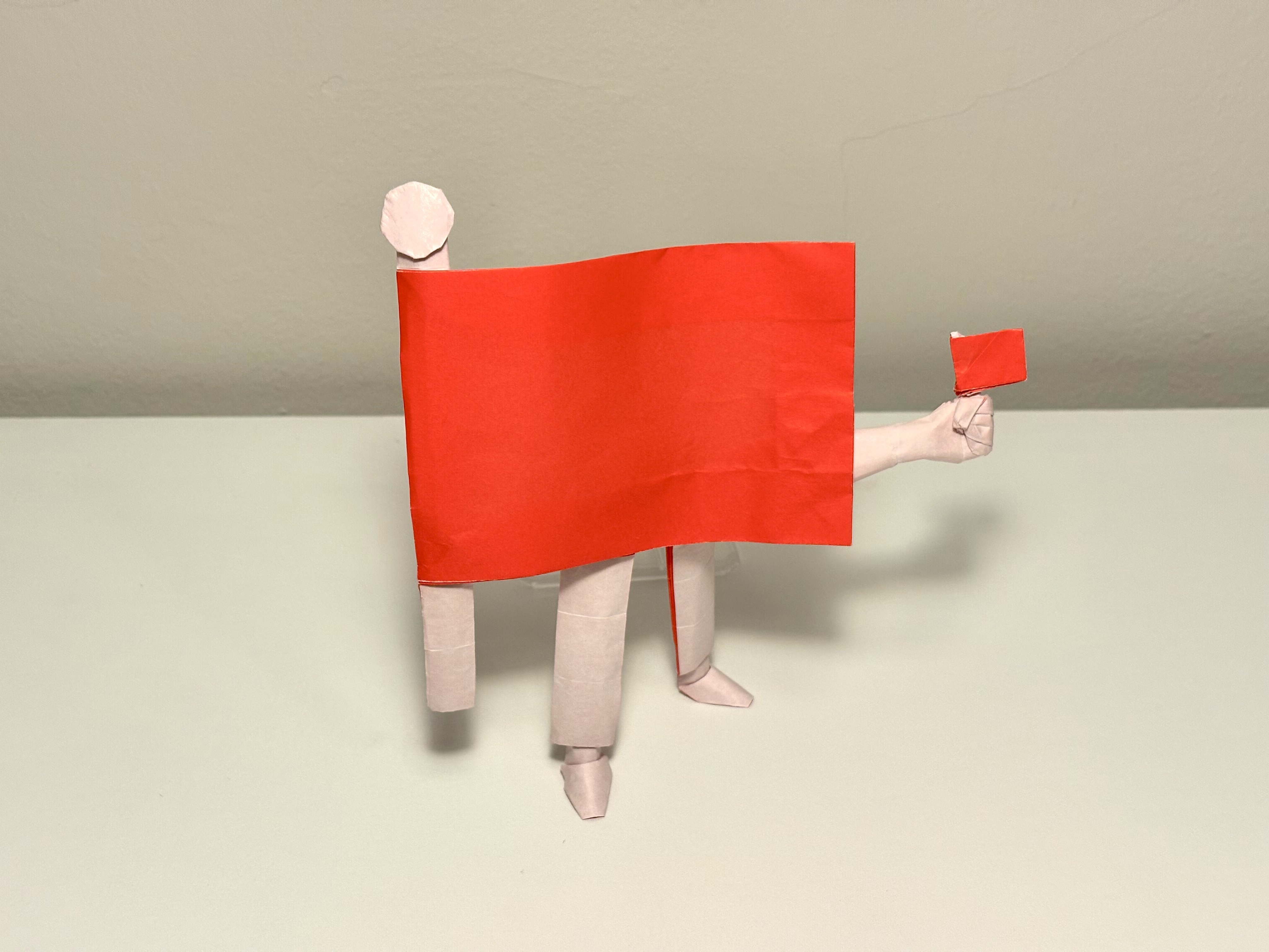 Origami red flag.